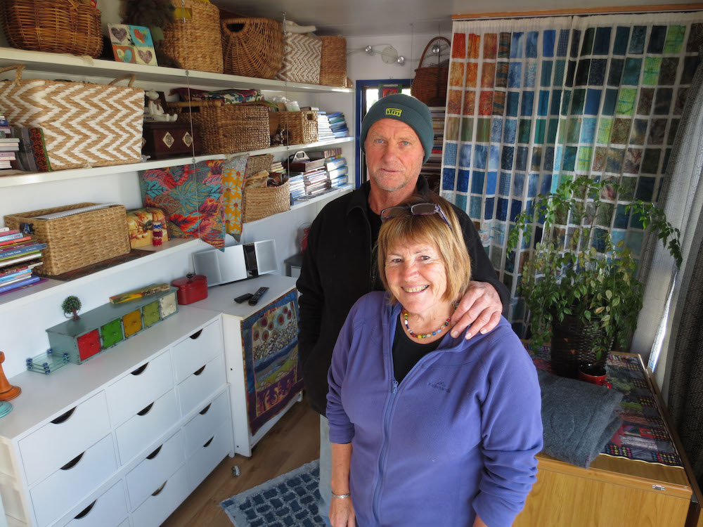 Paul Dayman & Marion Whyte in the annexe with Marion's quilting materials