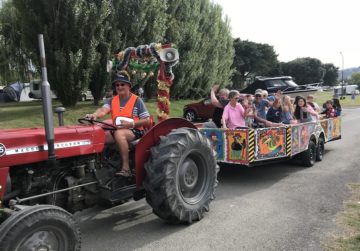 Harry Osborne driving the fun tractor at Tahuna Beach Holiday Park